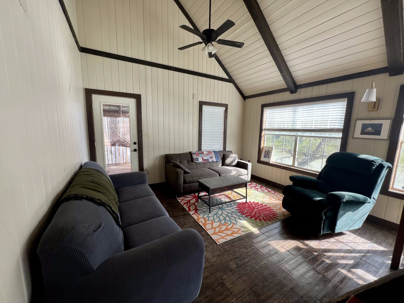Living room with cathedral ceiling and exposed wood beams