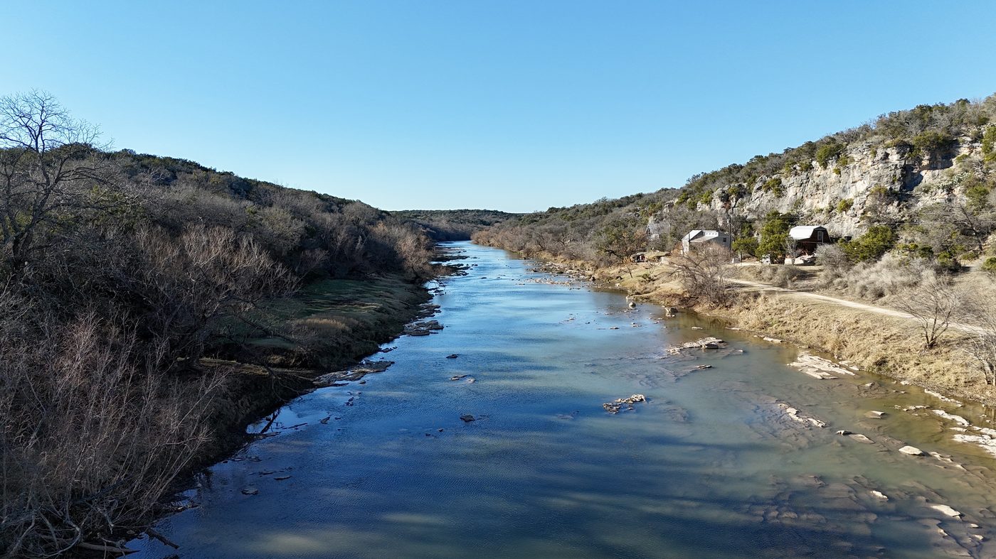 Wide view of the Colorado River winding through Texas Hill Country